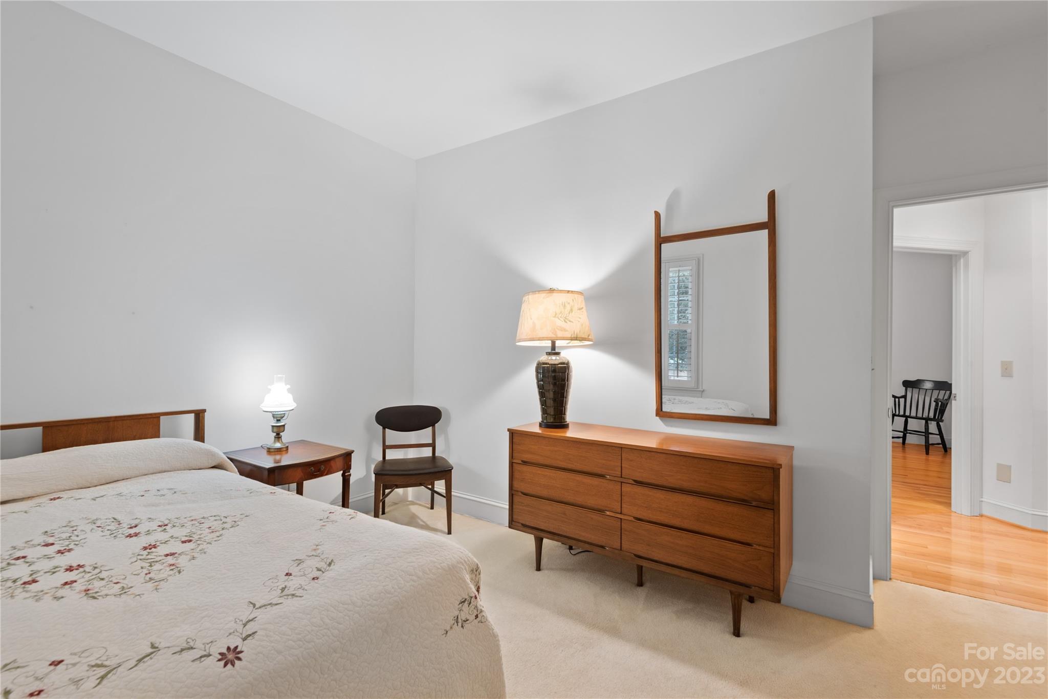 7604 Bosham Lane Charlotte, NC 28270 - Photo 25 of 39 a bedroom with a bed and a lamp