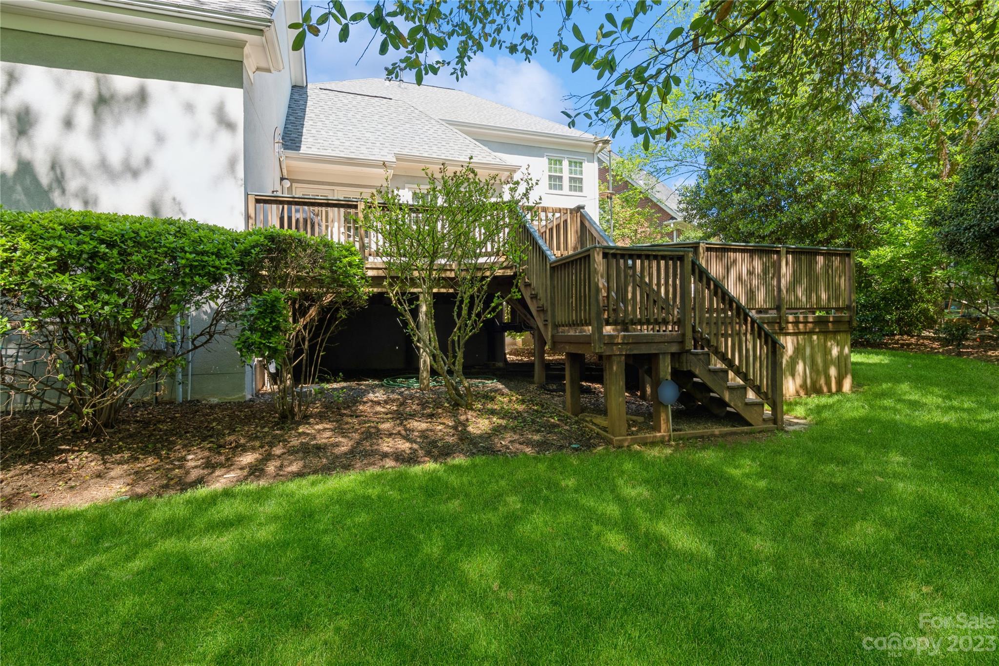 7604 Bosham Lane Charlotte, NC 28270 - Photo 33 of 39 a view of a chair and table in backyard of the house
