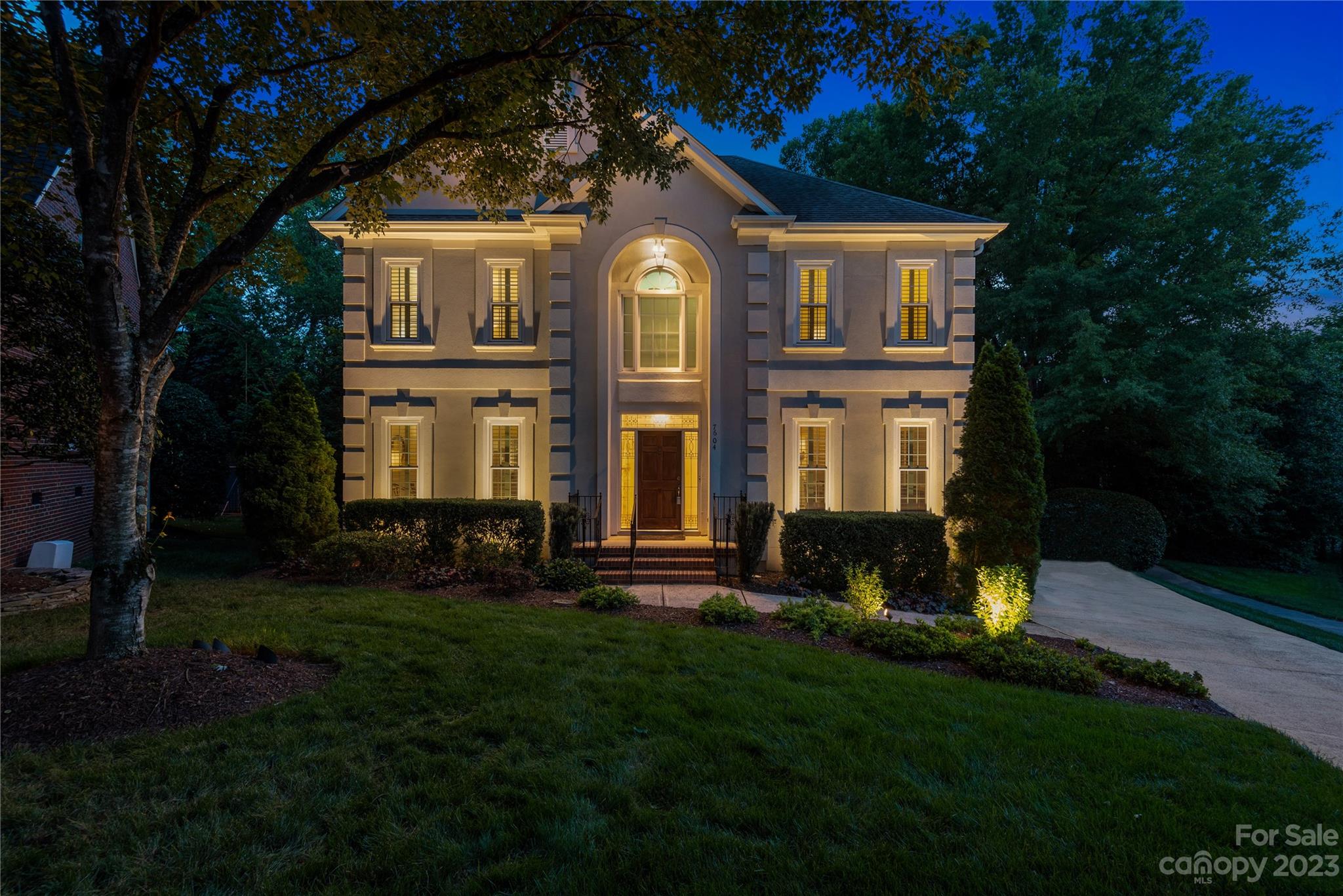 7604 Bosham Lane Charlotte, NC 28270 - Photo 35 of 39 a front view of a house with a yard