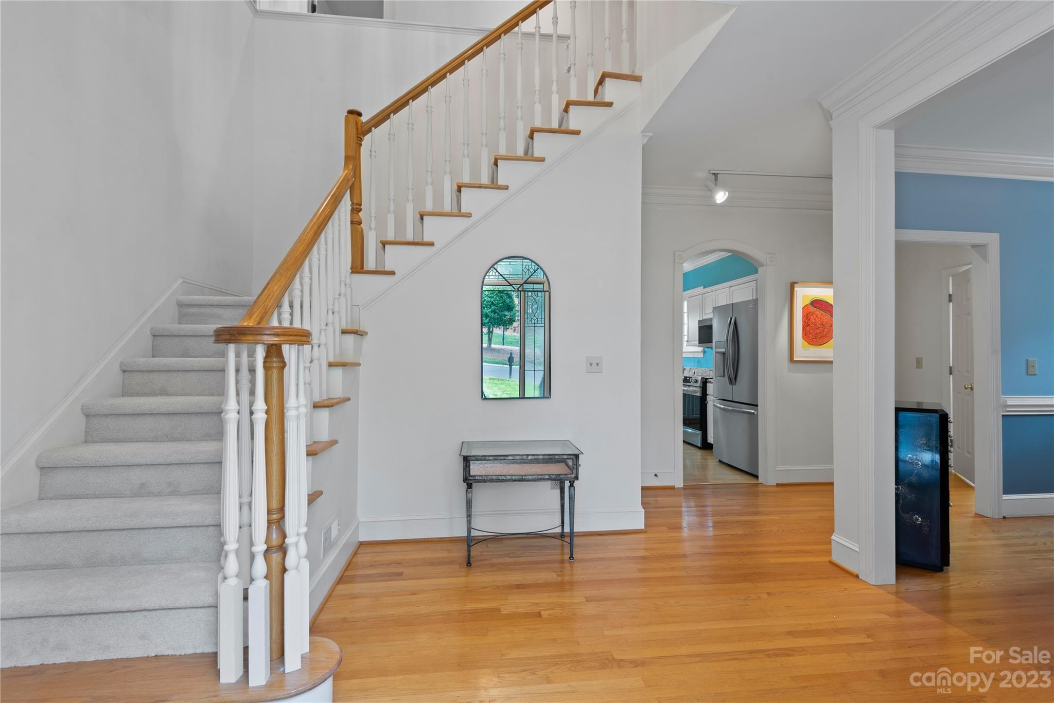 7604 Bosham Lane Charlotte, NC 28270 - Photo 4 of 39 a view of an entryway with wooden floor and windows