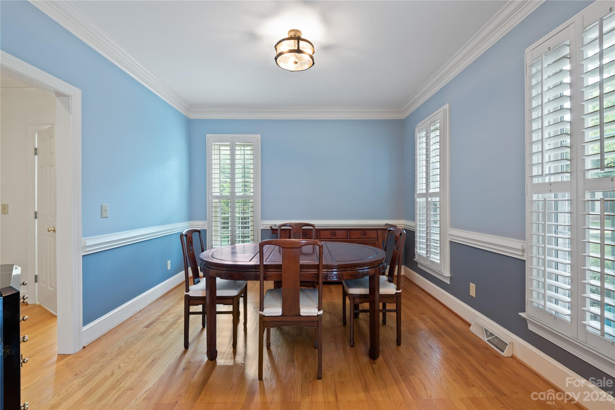7604 Bosham Lane Charlotte, NC 28270 - Photo 5 of 39 a view of a dining room with furniture window and wooden floor