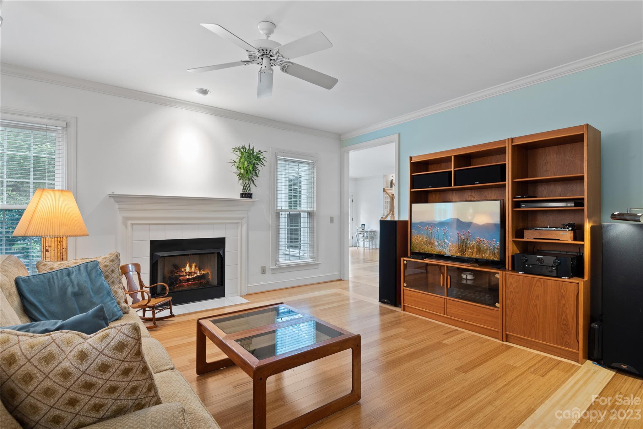 7604 Bosham Lane Charlotte, NC 28270 - Photo 8 of 39 a living room with furniture fireplace and flat screen tv