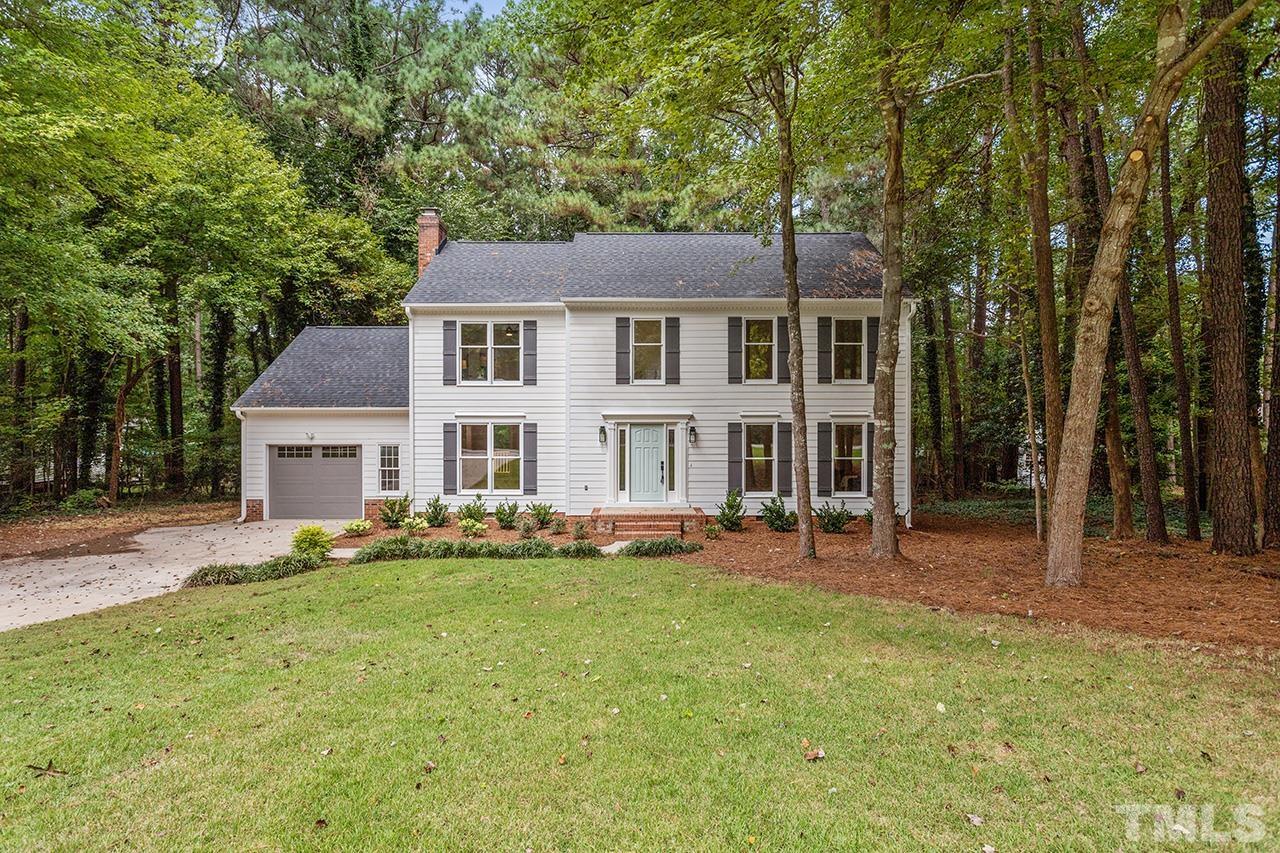 8805 Wellsley Way Raleigh, NC 27613 - Photo 1 of 39 a view of a house with a big yard and large trees