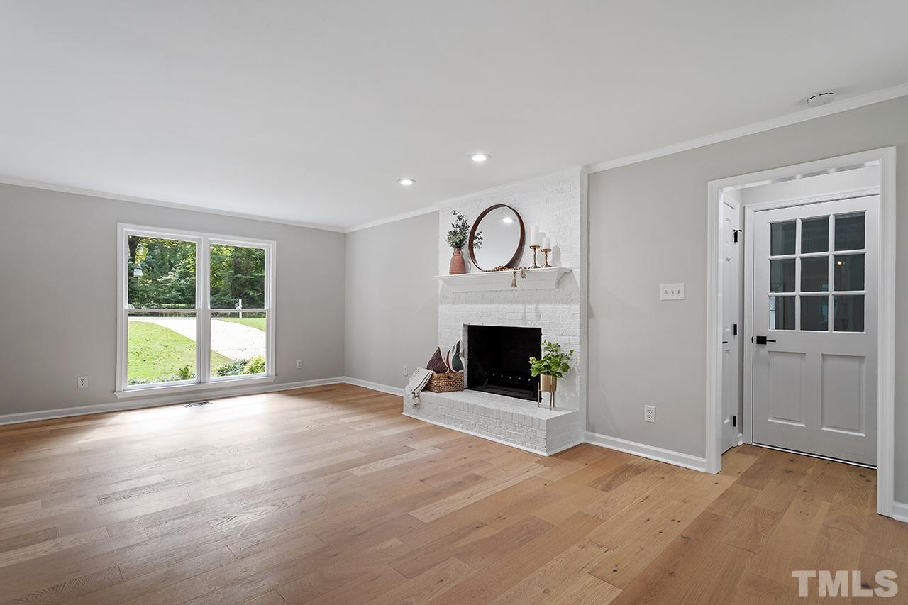 8805 Wellsley Way Raleigh, NC 27613 - Photo 13 of 39 a view of a livingroom with a fireplace and window