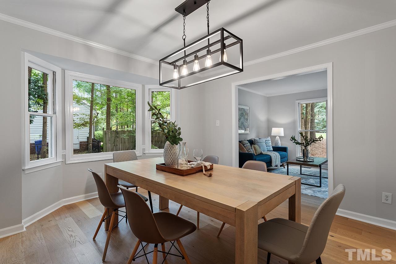 8805 Wellsley Way Raleigh, NC 27613 - Photo 15 of 39 a view of a dining room with furniture window and outside view