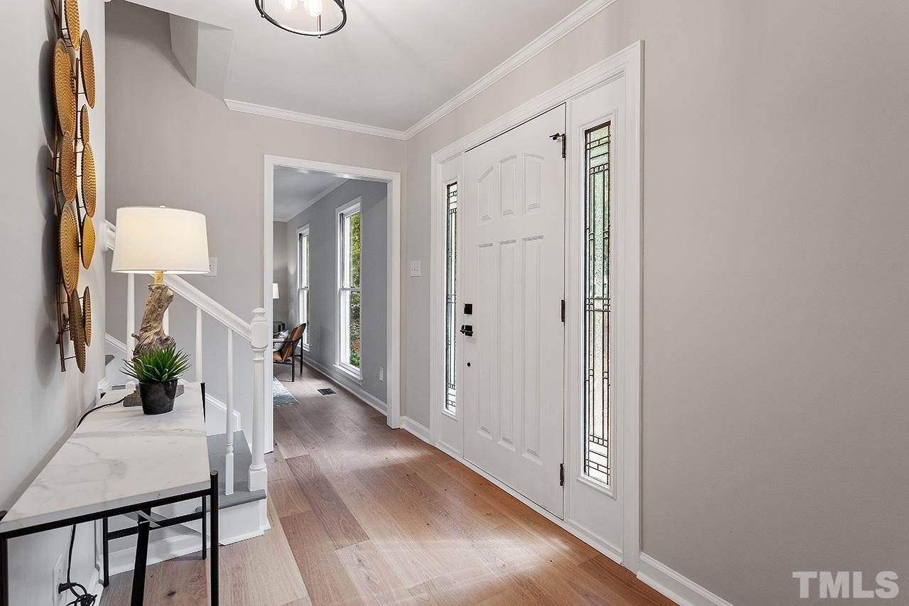 8805 Wellsley Way Raleigh, NC 27613 - Photo 17 of 39 a view of a hallway and dining room