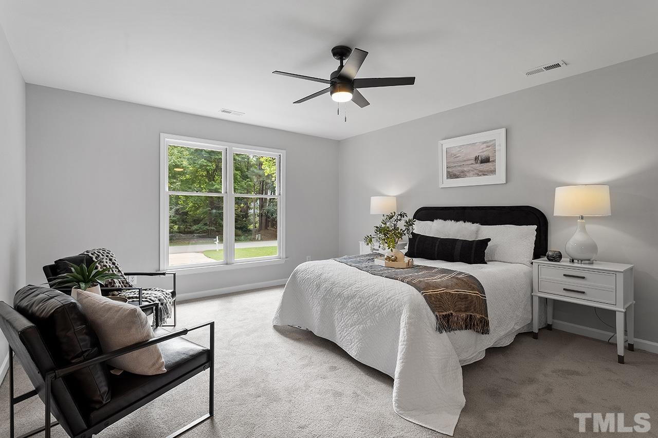 8805 Wellsley Way Raleigh, NC 27613 - Photo 19 of 39 a bedroom with a bed and window