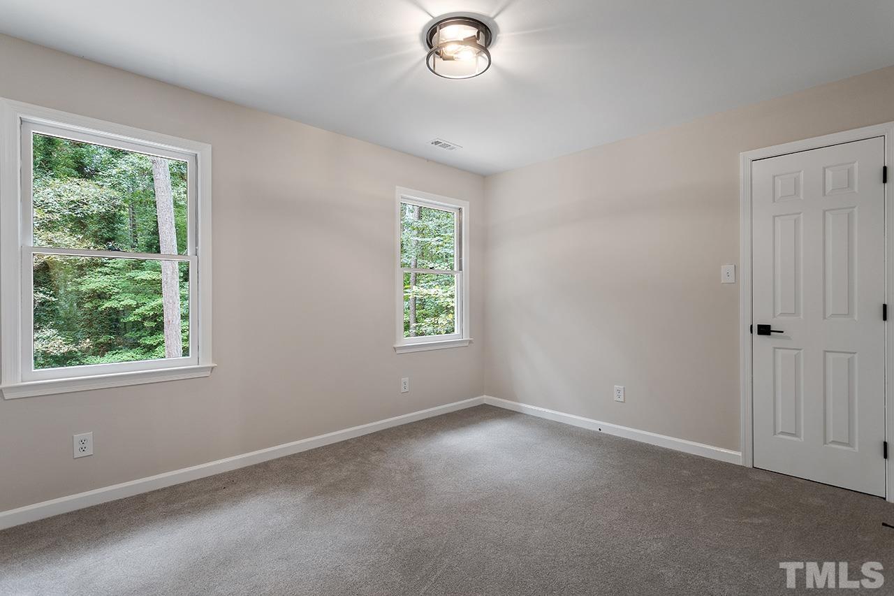 8805 Wellsley Way Raleigh, NC 27613 - Photo 22 of 39 an empty room with a window