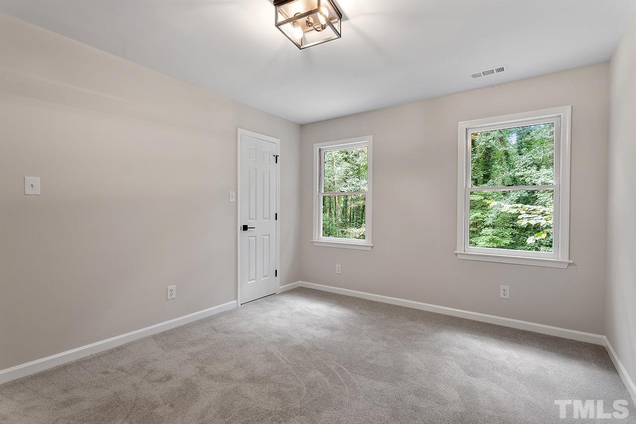 8805 Wellsley Way Raleigh, NC 27613 - Photo 23 of 39 an empty room with windows and closet