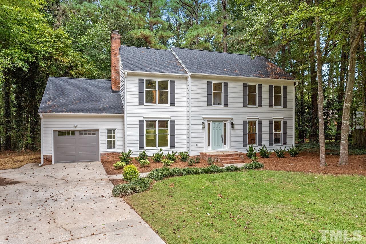8805 Wellsley Way Raleigh, NC 27613 - Photo 29 of 39 a front view of a house with a yard and trees