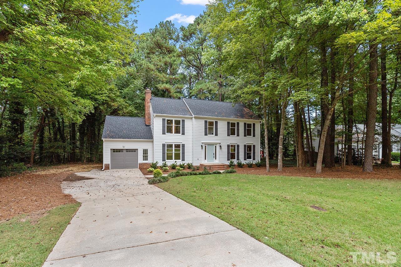 8805 Wellsley Way Raleigh, NC 27613 - Photo 30 of 39 a front view of a house with a yard