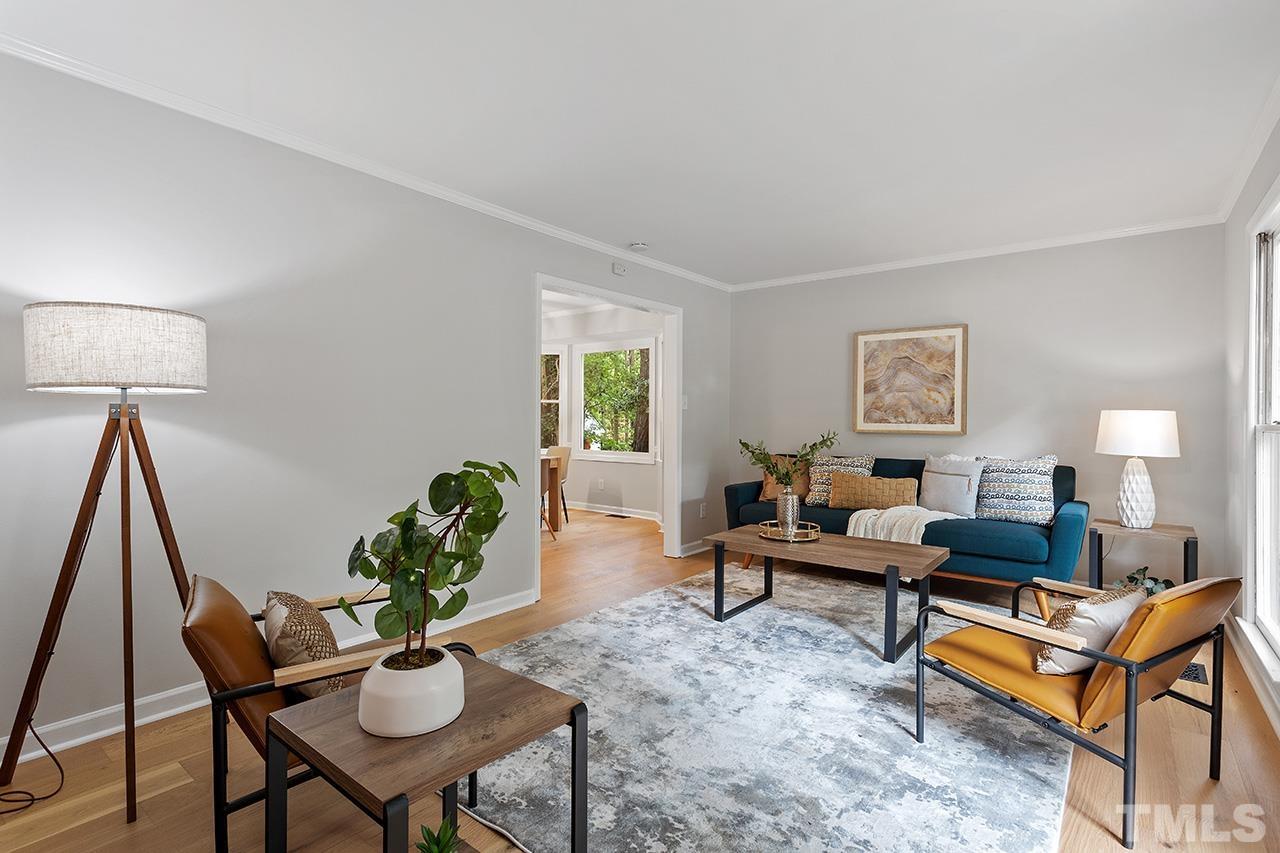 8805 Wellsley Way Raleigh, NC 27613 - Photo 3 of 39 a living room with furniture and a wooden floor