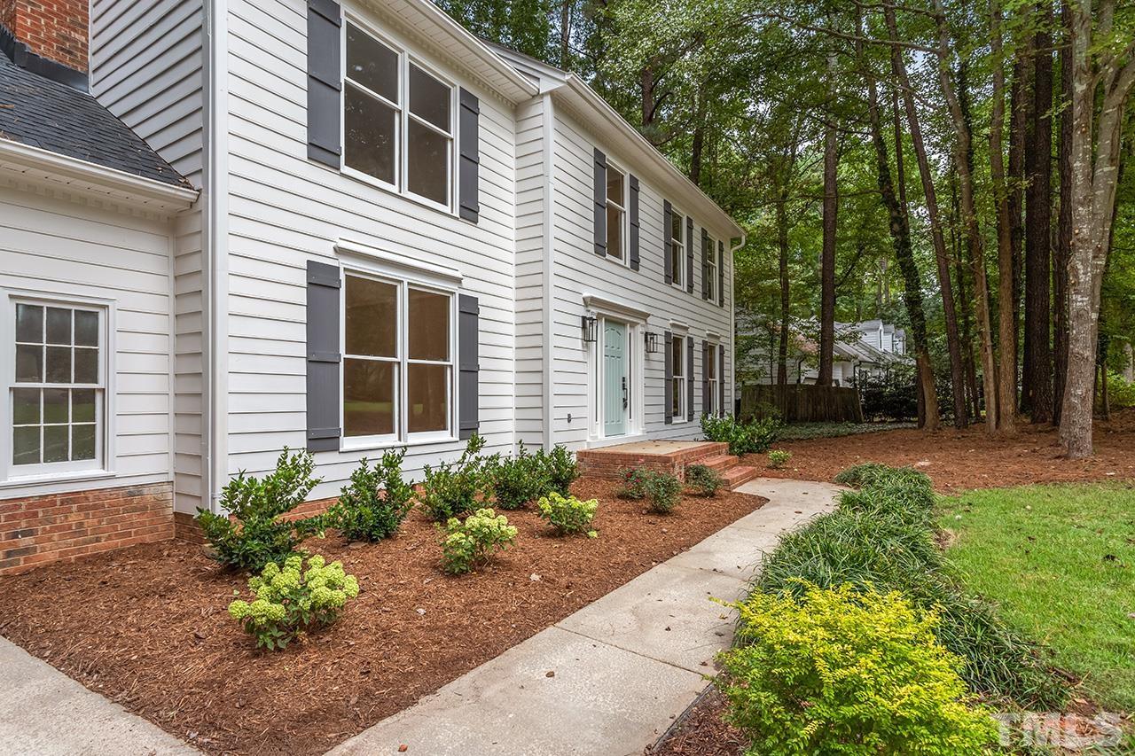 8805 Wellsley Way Raleigh, NC 27613 - Photo 33 of 39 a front view of a house with garden