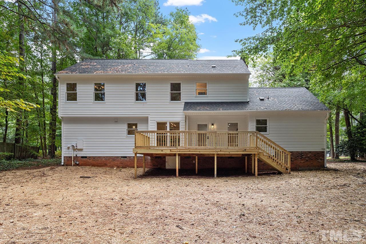 8805 Wellsley Way Raleigh, NC 27613 - Photo 34 of 39 a view of a house with a yard and sitting area