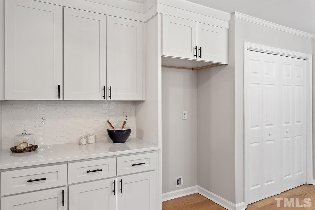 8805 Wellsley Way Raleigh, NC 27613 - Photo 7 of 39 a view of cabinets and window