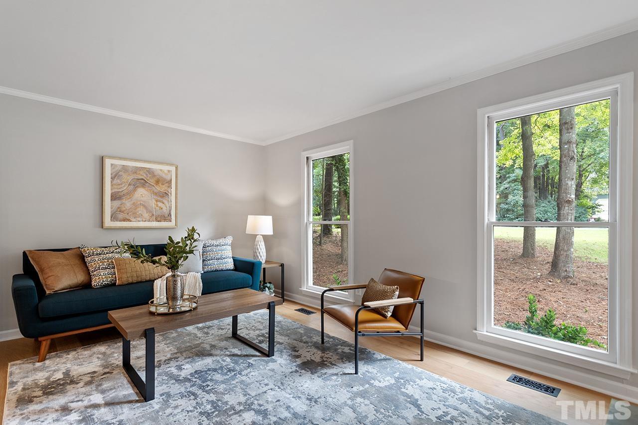 8805 Wellsley Way Raleigh, NC 27613 - Photo 9 of 39 a living room with furniture and a window