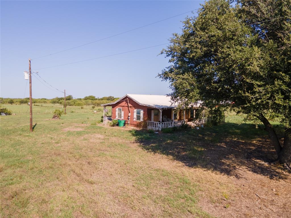1300 Old Base Road Aurora, TX 76078 - Photo 19 of 27 a view of a house with a yard