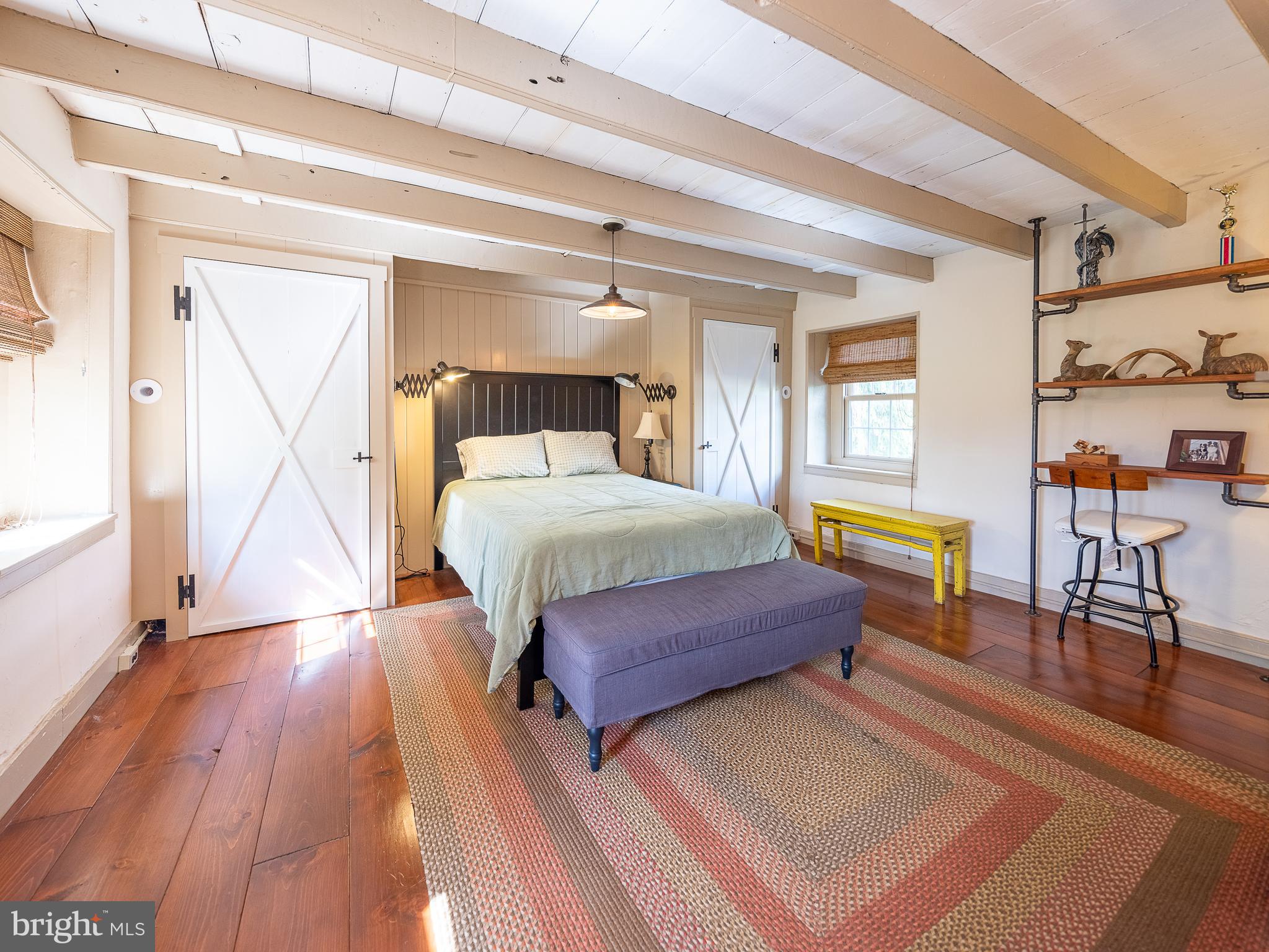 1601 Forest Grove Road Furlong, PA 18925 - Photo 29 of 57 a bedroom with a bed and wooden floor
