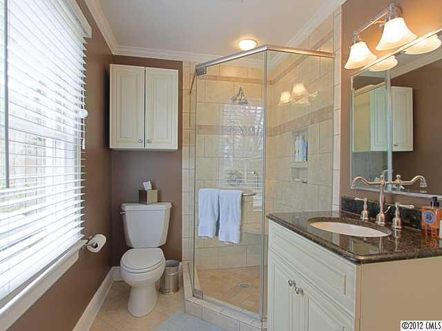 2012 Club Road Charlotte, NC 28205 - Photo 12 of 15 a bathroom with a toilet sink and mirror