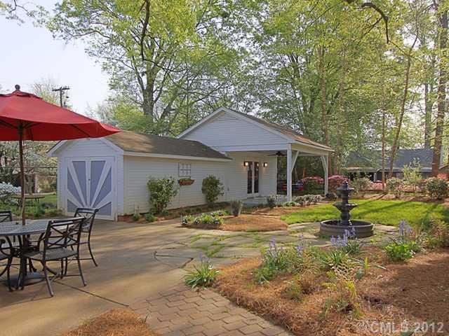 2012 Club Road Charlotte, NC 28205 - Photo 14 of 15 a backyard of a house with barbeque oven table and chairs
