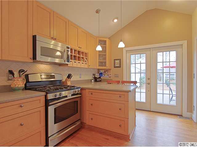 2012 Club Road Charlotte, NC 28205 - Photo 6 of 15 a kitchen with stainless steel appliances granite countertop a stove and a sink