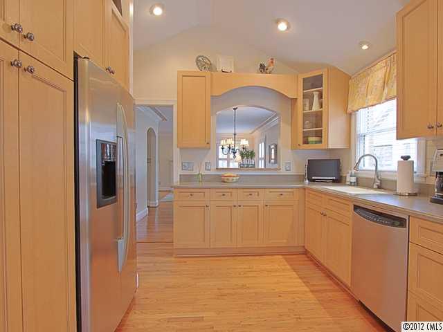 2012 Club Road Charlotte, NC 28205 - Photo 7 of 15 a kitchen with stainless steel appliances granite countertop a refrigerator and a sink