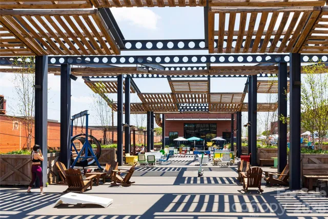 a view of a swimming pool with sitting area