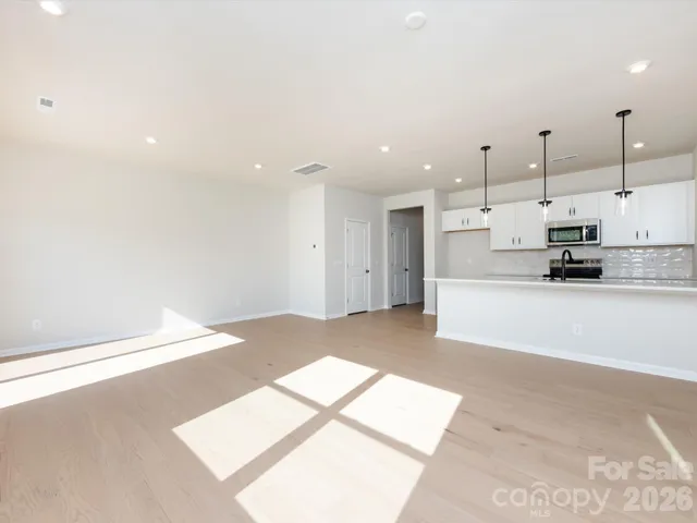 a view of kitchen with wooden floor