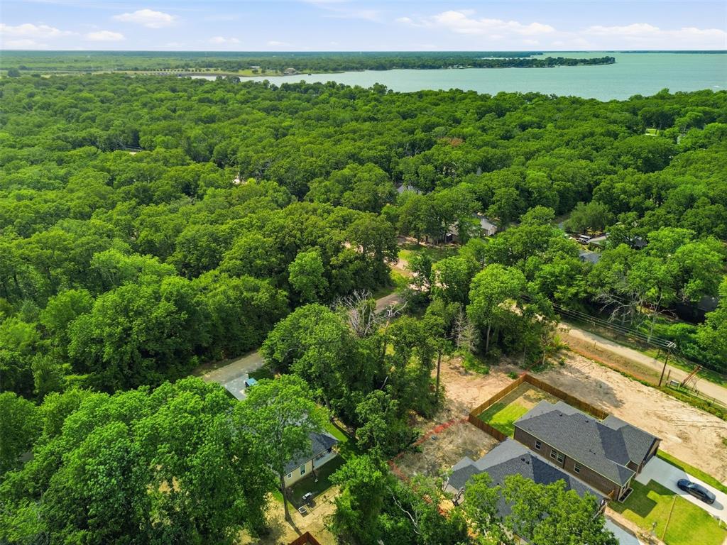 429 Waterboard Road Trinidad, TX 75163 - Photo 25 of 25 Aerial perspective showcasing extensive tree coverage, a prominent body of water, and residential properties