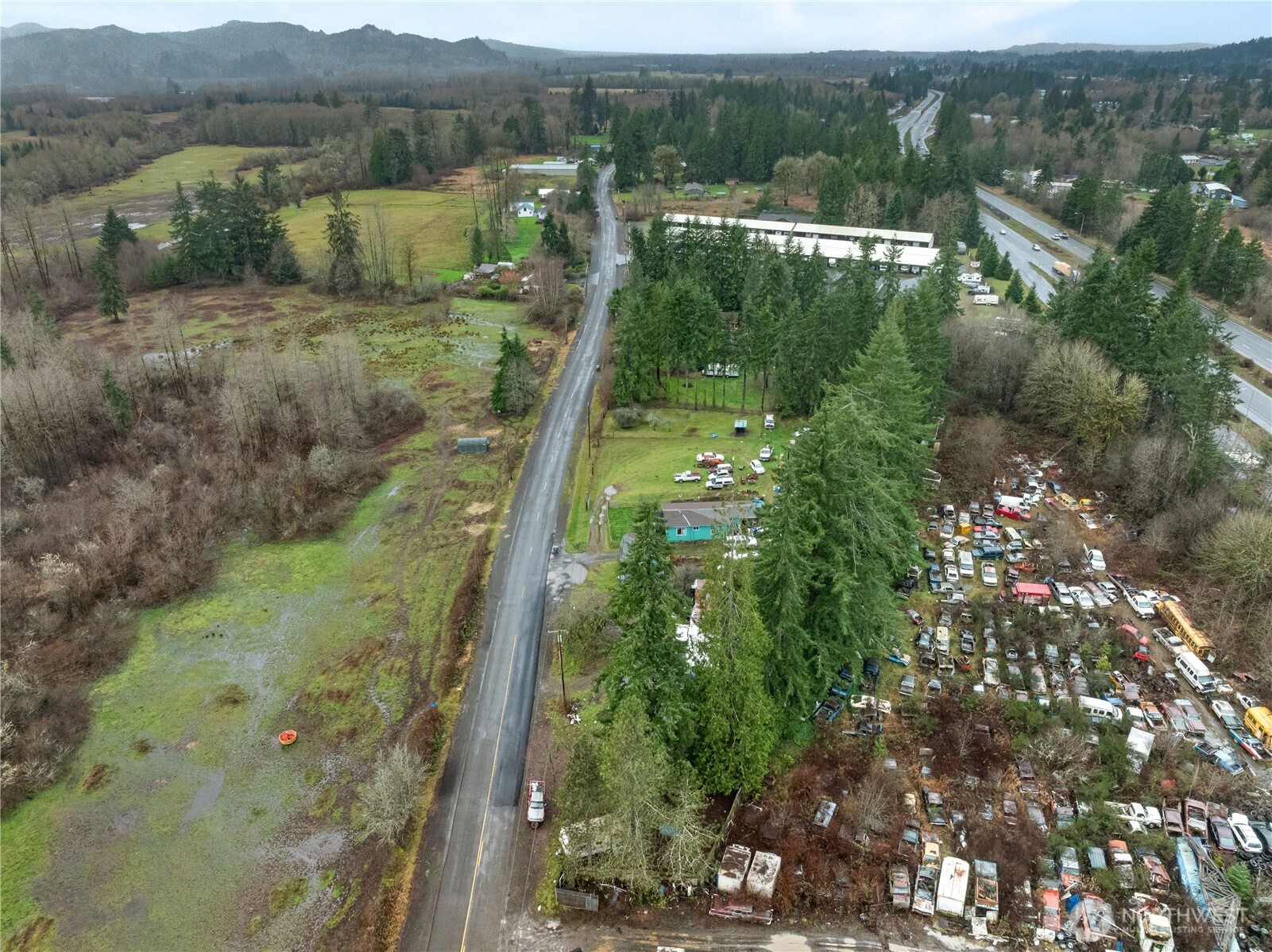 139 Monte Brady Road Montesano, WA 98563 - Photo 9 of 9 a view of a lush green forest with houses