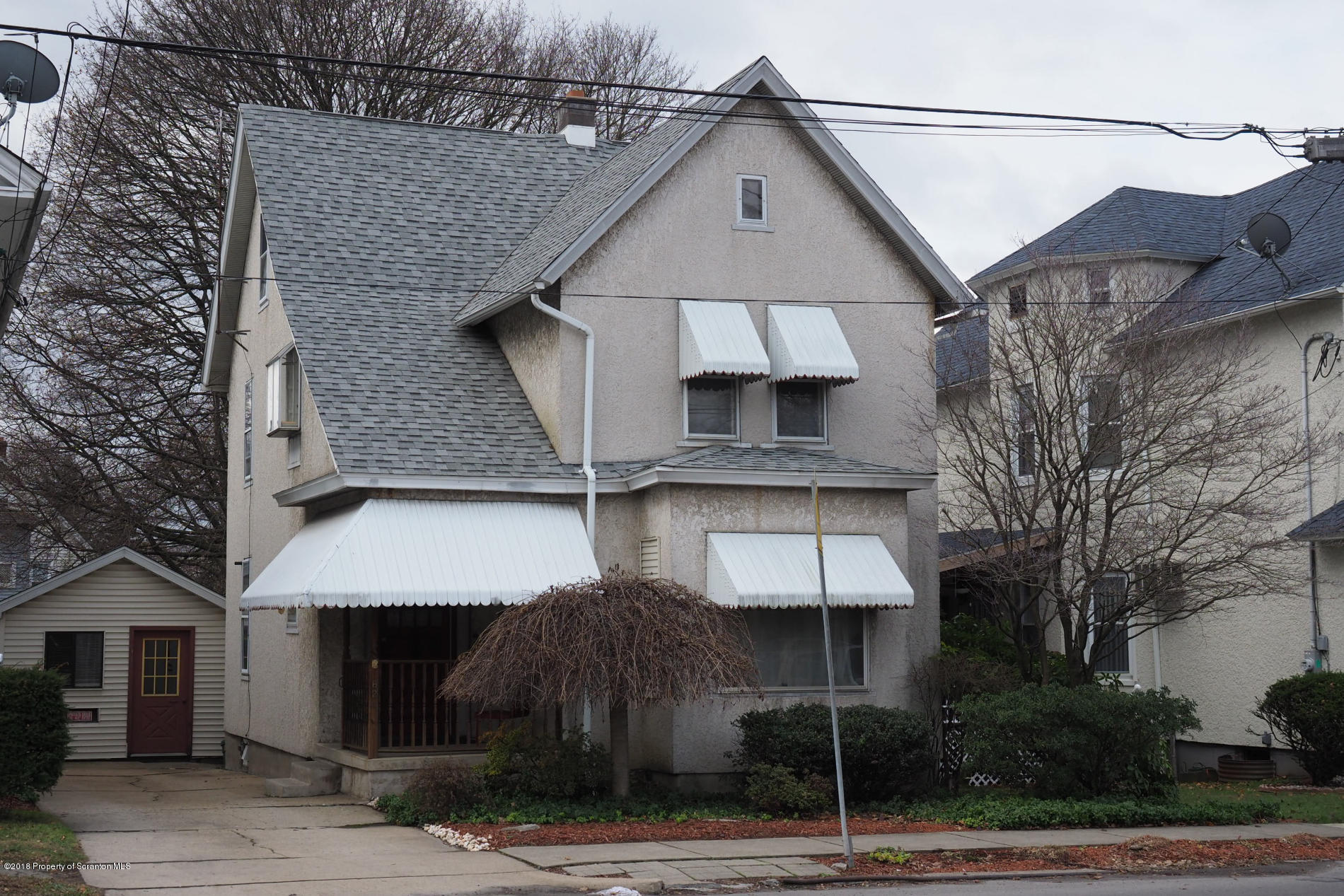824 Green Ridge Street Scranton, PA 18509 - Photo 1 of 17 a front view of a house with garage