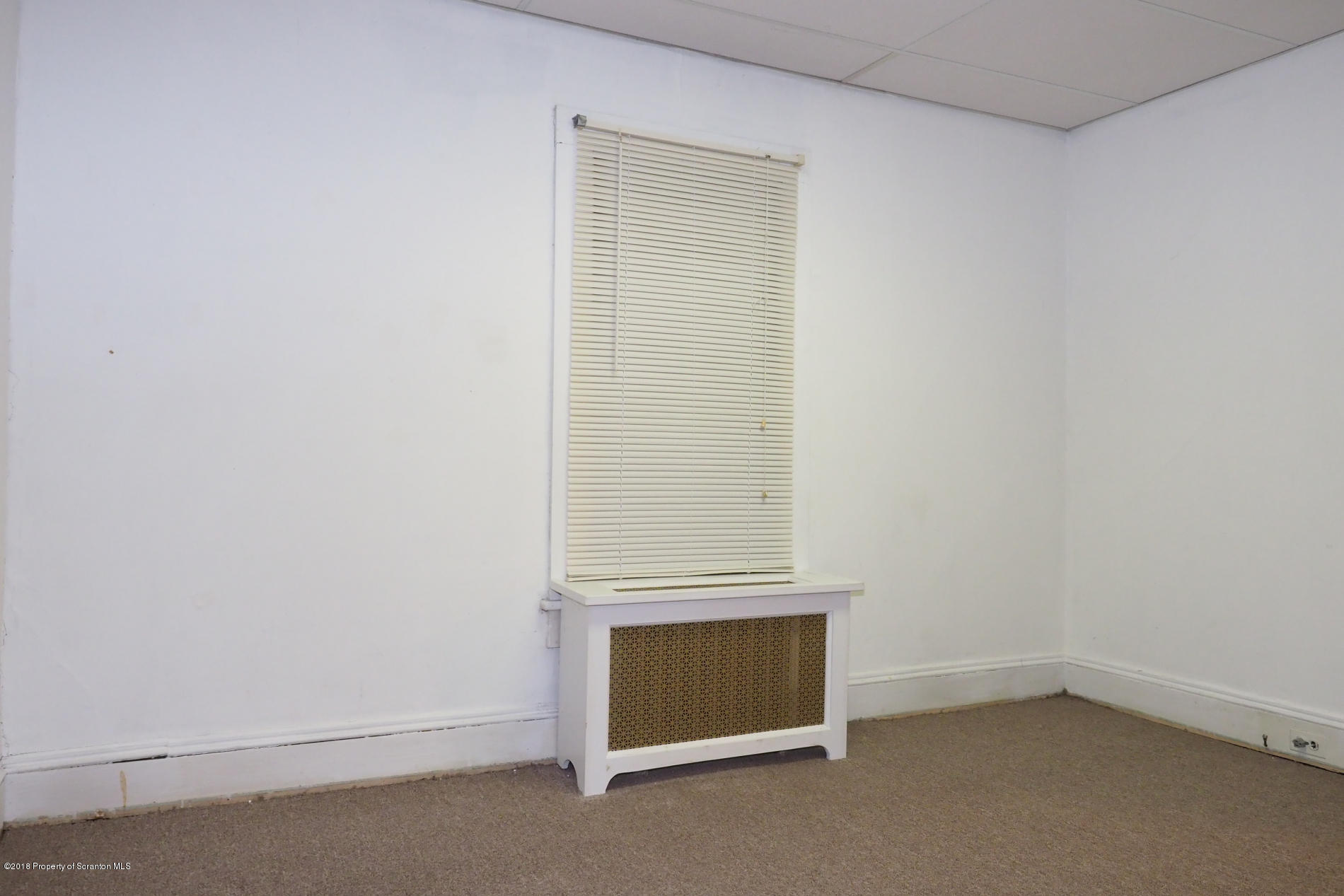 824 Green Ridge Street Scranton, PA 18509 - Photo 13 of 17 an empty room with a bench