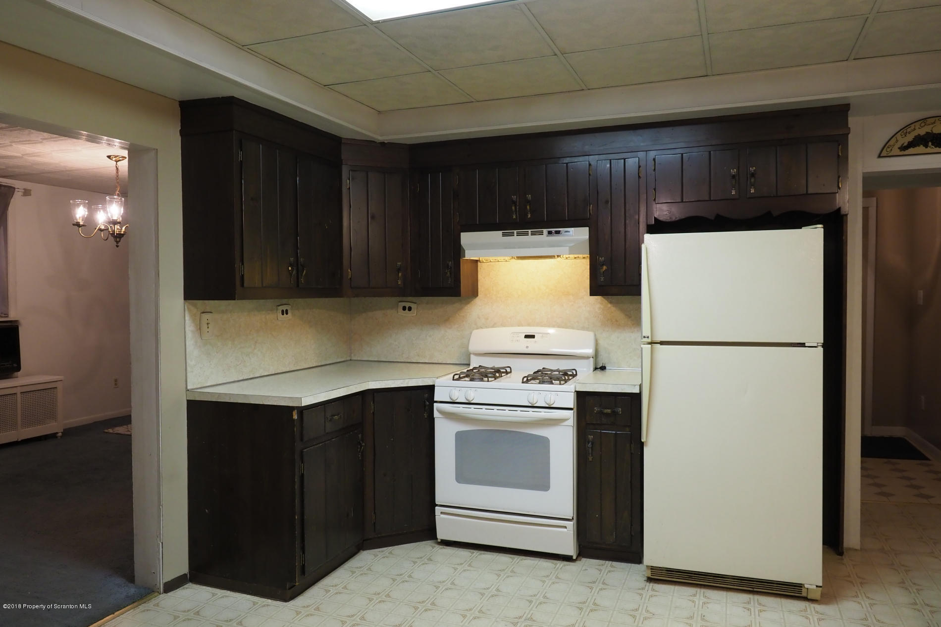 824 Green Ridge Street Scranton, PA 18509 - Photo 5 of 17 a kitchen with a stove a refrigerator and a sink