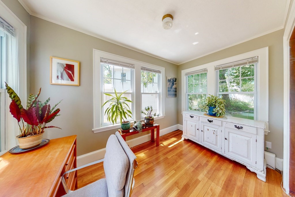 29 Hutchins Road Medford, MA 02155 - Photo 11 of 34 a living room with furniture fireplace and wooden floor