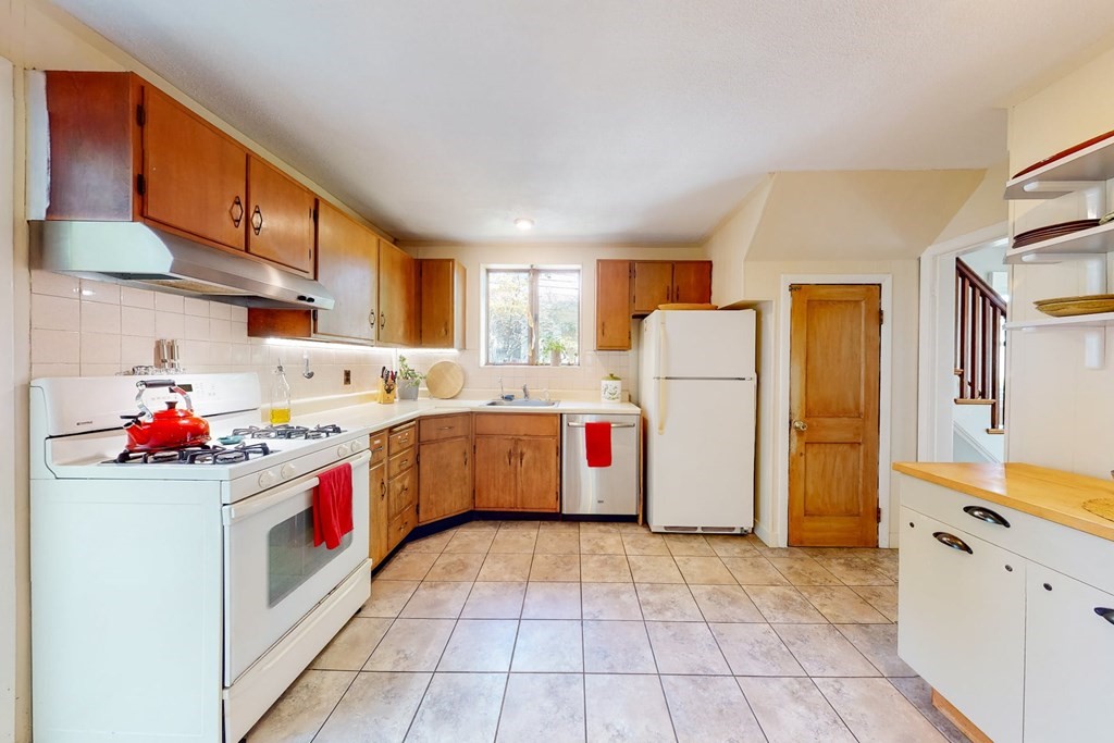 29 Hutchins Road Medford, MA 02155 - Photo 16 of 34 a utility room with cabinets washer and dryer