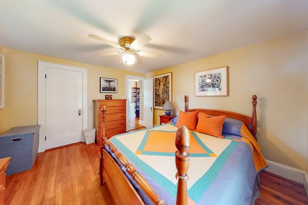 29 Hutchins Road Medford, MA 02155 - Photo 21 of 34 a bedroom with a bed and a chandelier