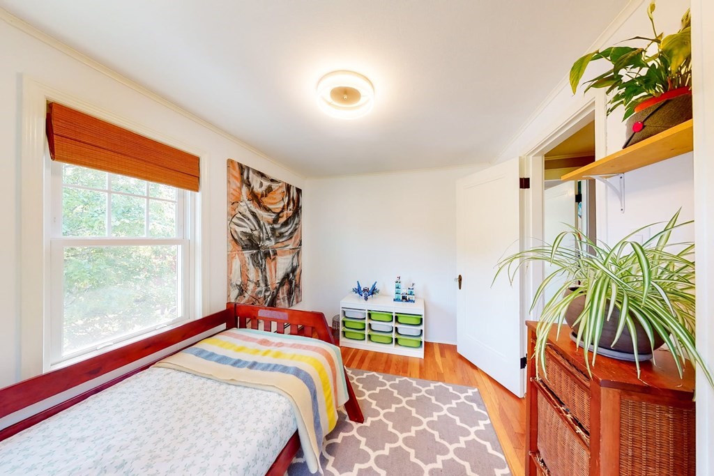 29 Hutchins Road Medford, MA 02155 - Photo 27 of 34 a bed sitting in a bedroom next to a window