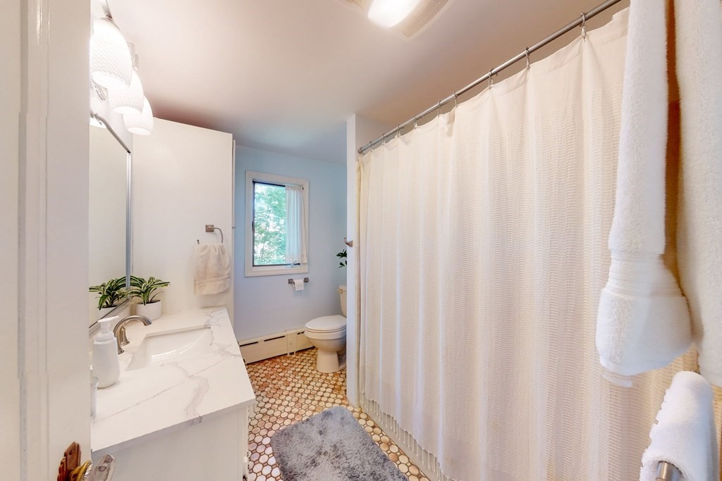 29 Hutchins Road Medford, MA 02155 - Photo 28 of 34 a bathroom with a sink toilet and shower