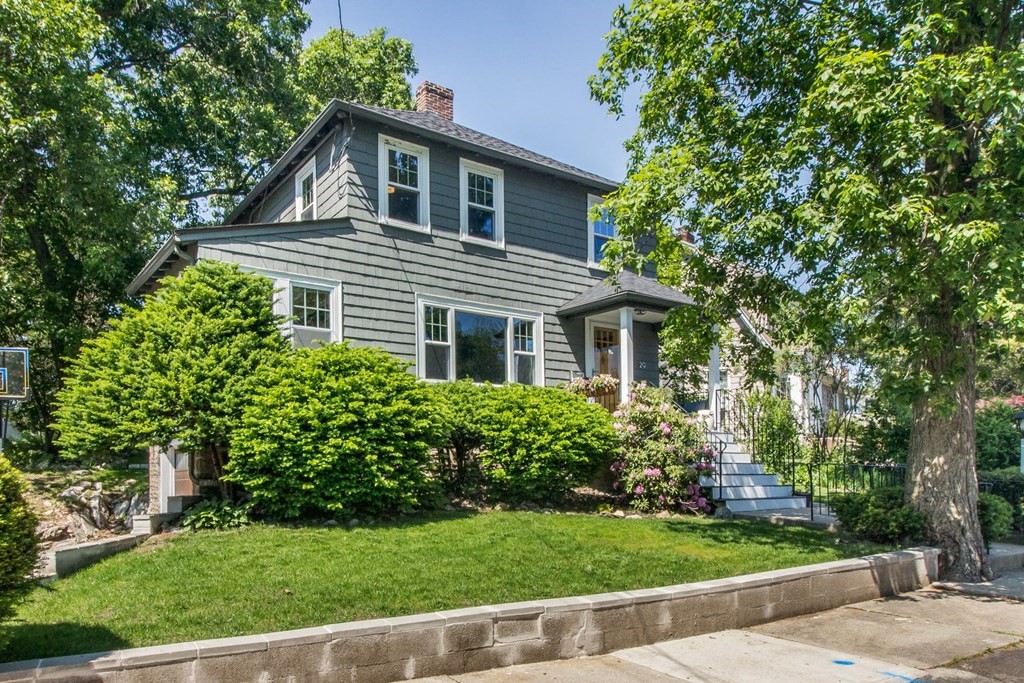 29 Hutchins Road Medford, MA 02155 - Photo 3 of 34 a front view of a house with a yard