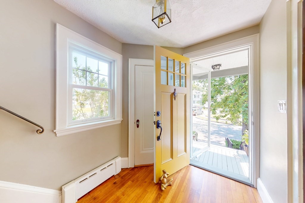 29 Hutchins Road Medford, MA 02155 - Photo 5 of 34 a view of a room with wooden floor and windows