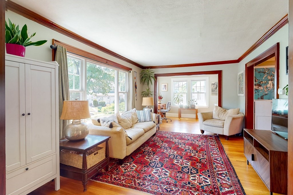 29 Hutchins Road Medford, MA 02155 - Photo 7 of 34 a living room with furniture and a large window