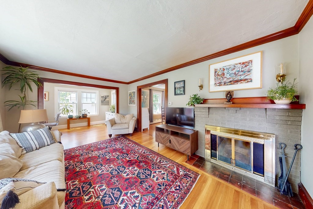 29 Hutchins Road Medford, MA 02155 - Photo 8 of 34 a living room with furniture a rug and a floor to ceiling window