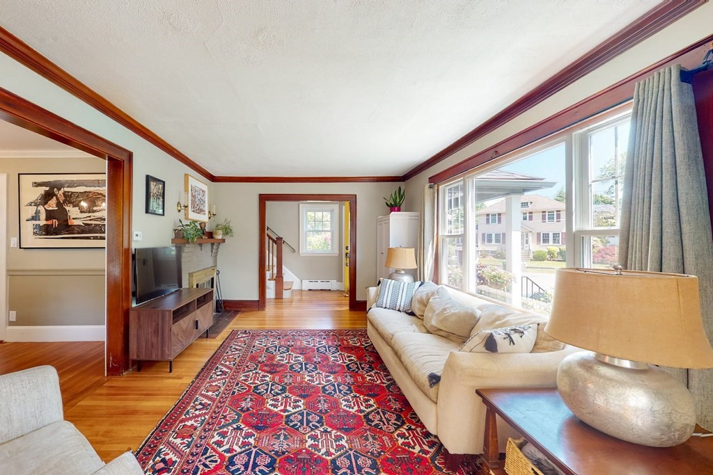 29 Hutchins Road Medford, MA 02155 - Photo 9 of 34 a living room with furniture and a flat screen tv