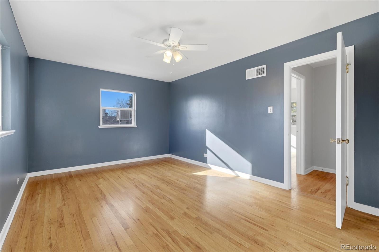 2053 Quitman Street Denver, CO 80212 - Photo 15 of 39 a view of empty room with wooden floor