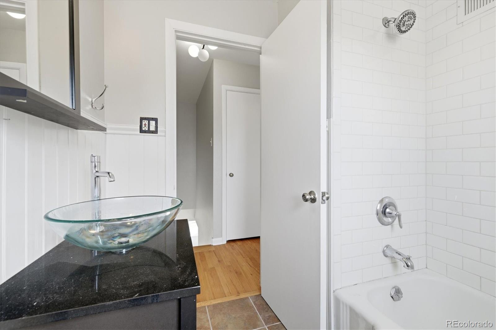 2053 Quitman Street Denver, CO 80212 - Photo 20 of 39 a bathroom with a sink a toilet and shower