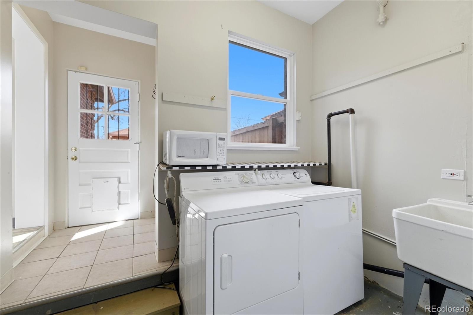 2053 Quitman Street Denver, CO 80212 - Photo 22 of 39 a utility room with dryer and washer