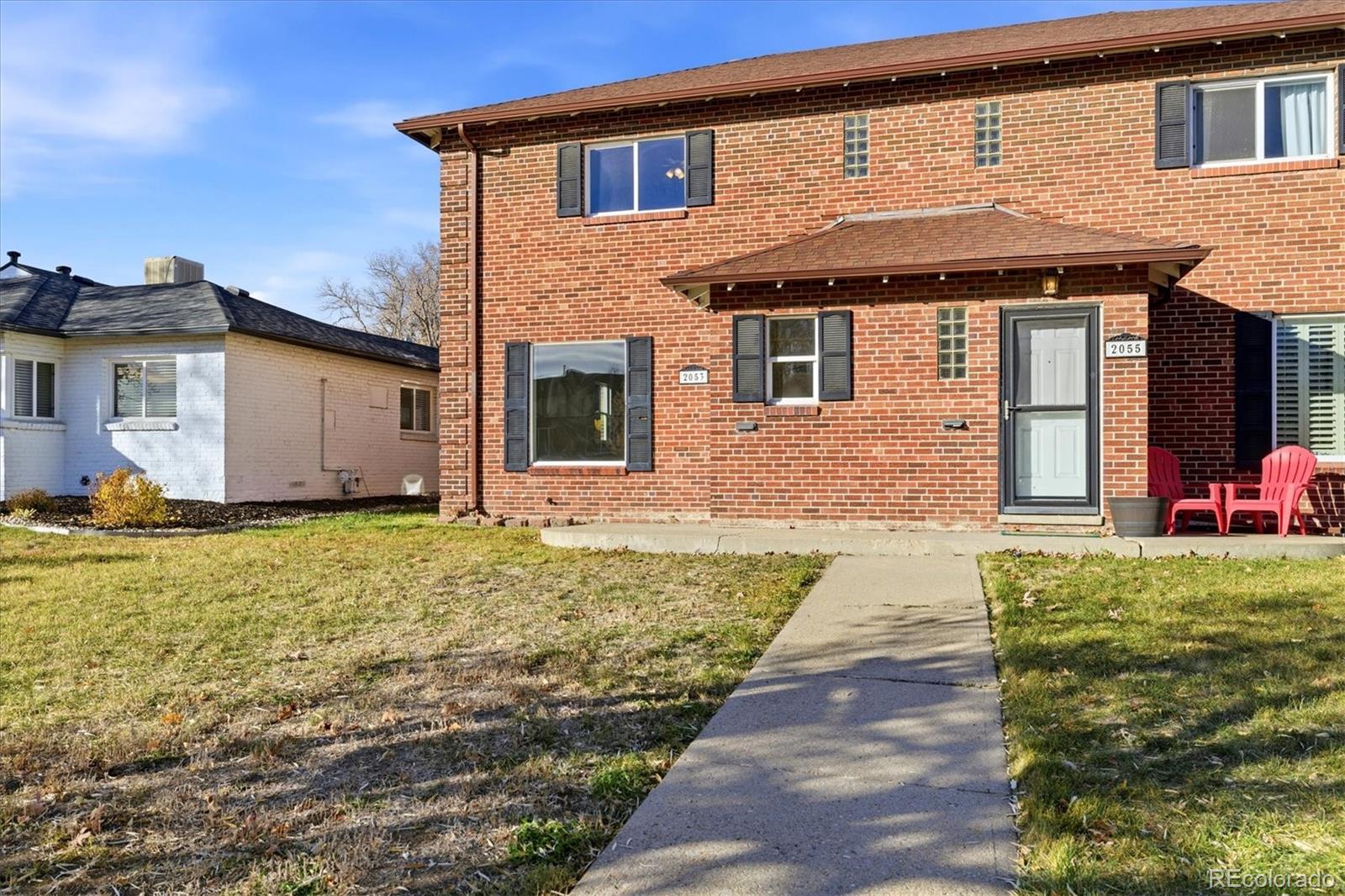 2053 Quitman Street Denver, CO 80212 - Photo 29 of 39 a front view of a house with a yard