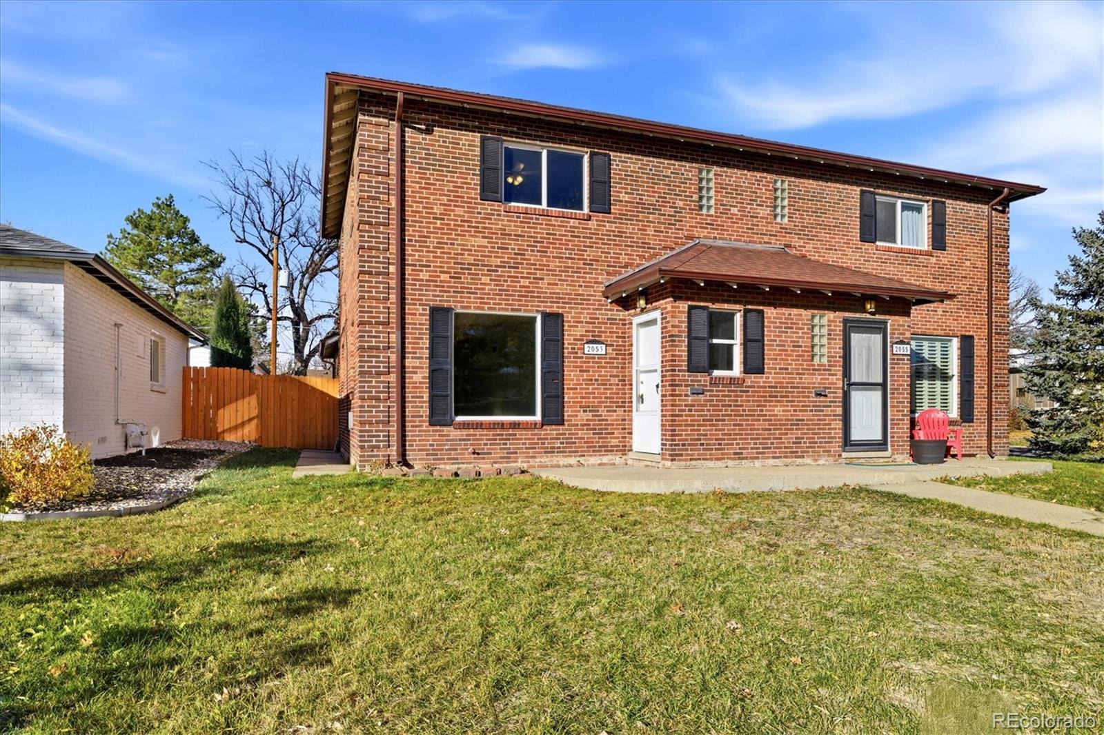 2053 Quitman Street Denver, CO 80212 - Photo 30 of 39 a front view of a house with a yard