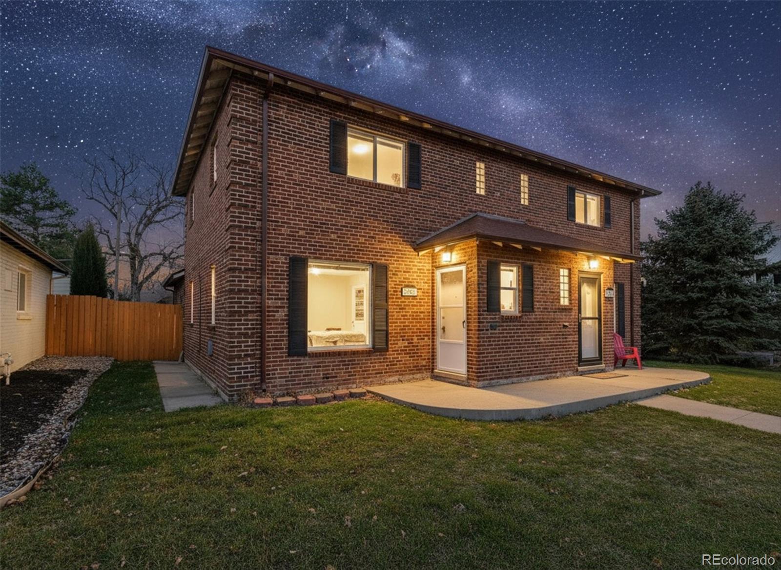 2053 Quitman Street Denver, CO 80212 - Photo 31 of 39 a front view of a house with a yard