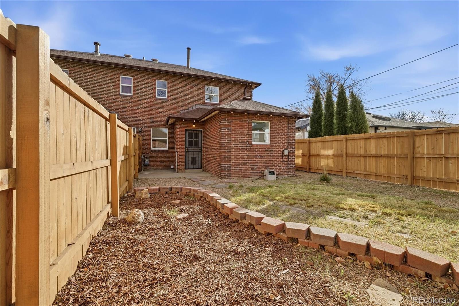 2053 Quitman Street Denver, CO 80212 - Photo 32 of 39 a view of a house with a yard